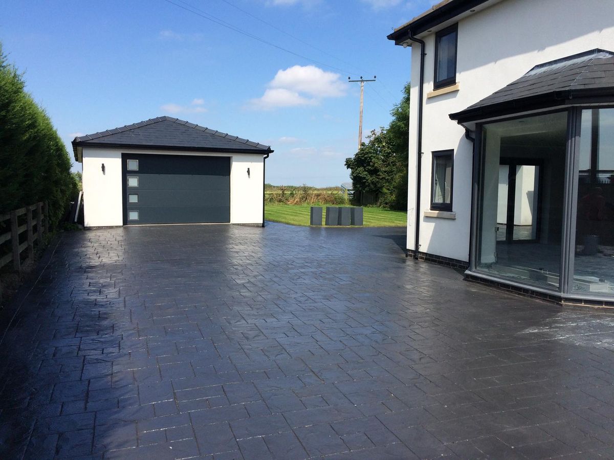 A freshly laid imprinted concrete driveway in Warrington